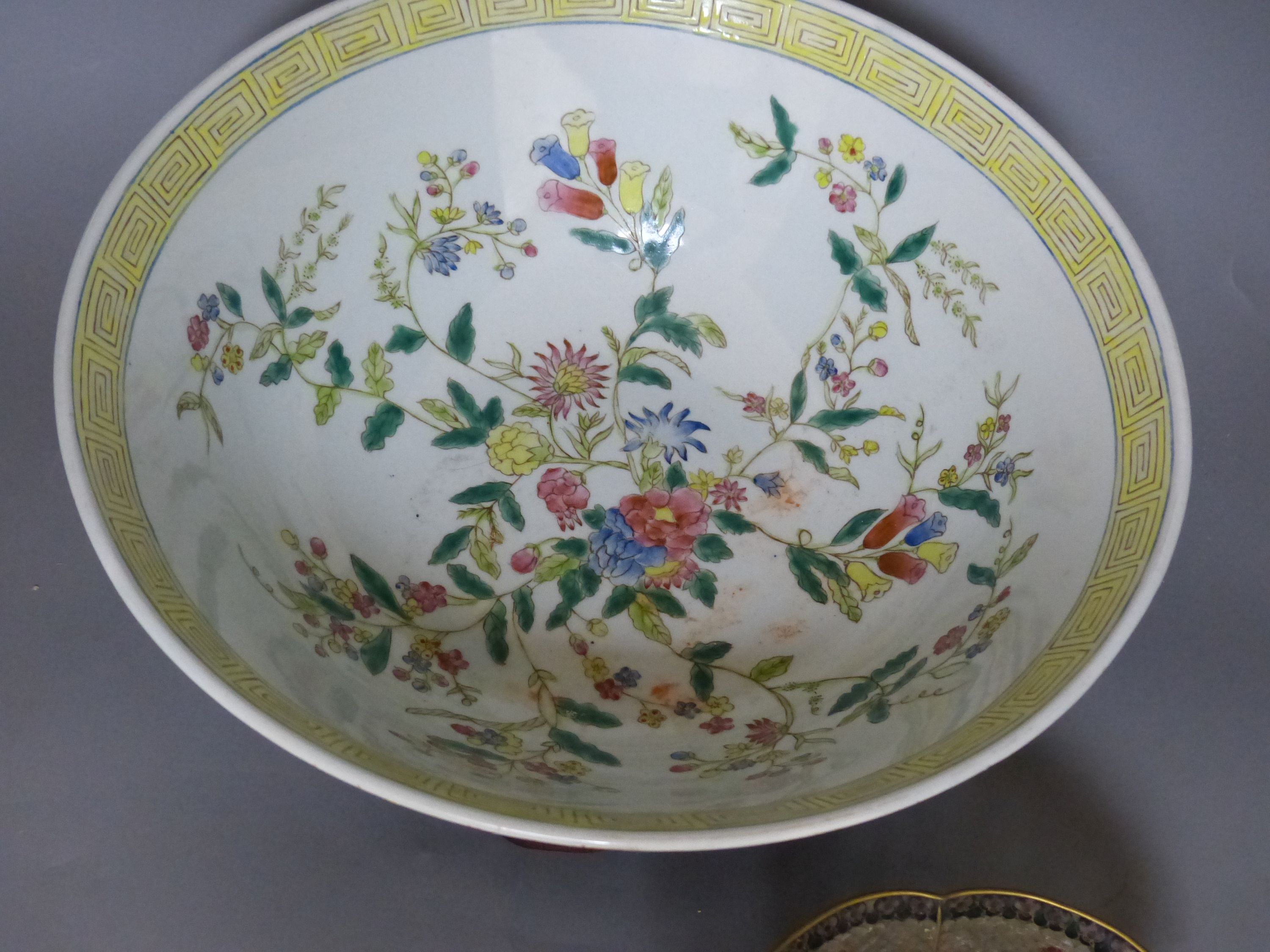 A Chinese plique a jour enamel bowl on stand, and a Chinese famille rose bowl on stand, largest 33cm diameter